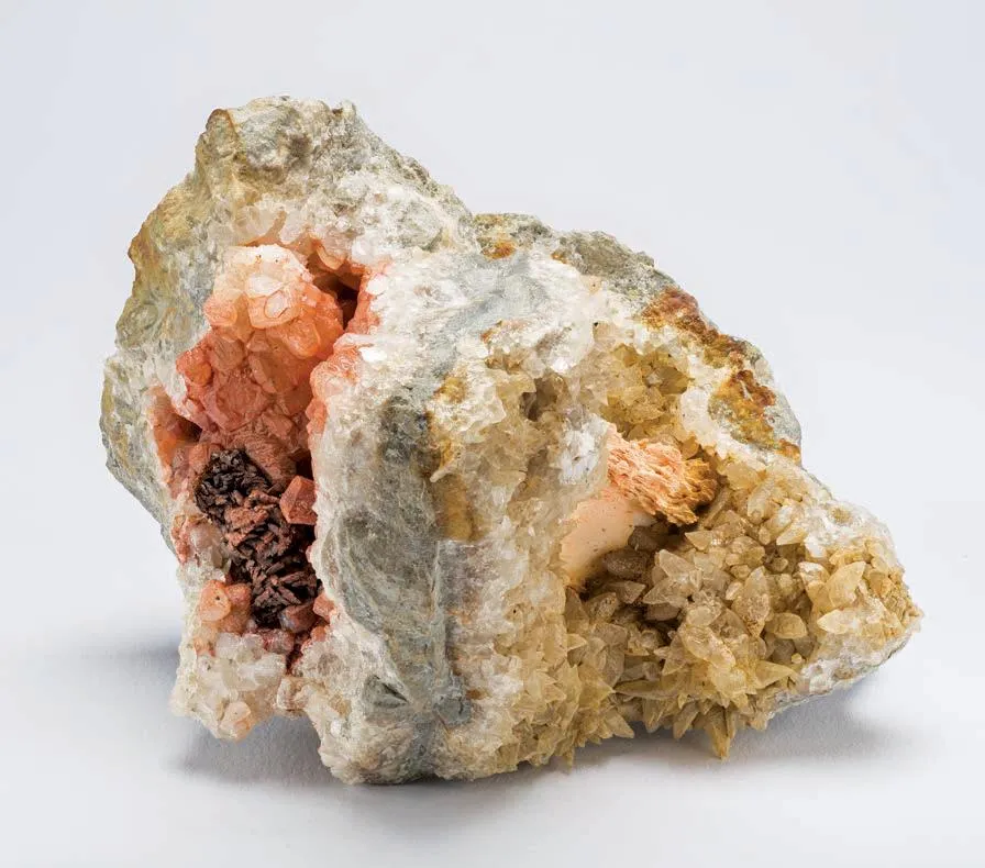 Limonite after Dolomite on Calcite with Barite - image 1