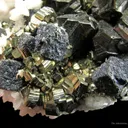 Manganoan Calcite (Fluorescent) on Sphalerite, Pyrite, and Galena - image 4
