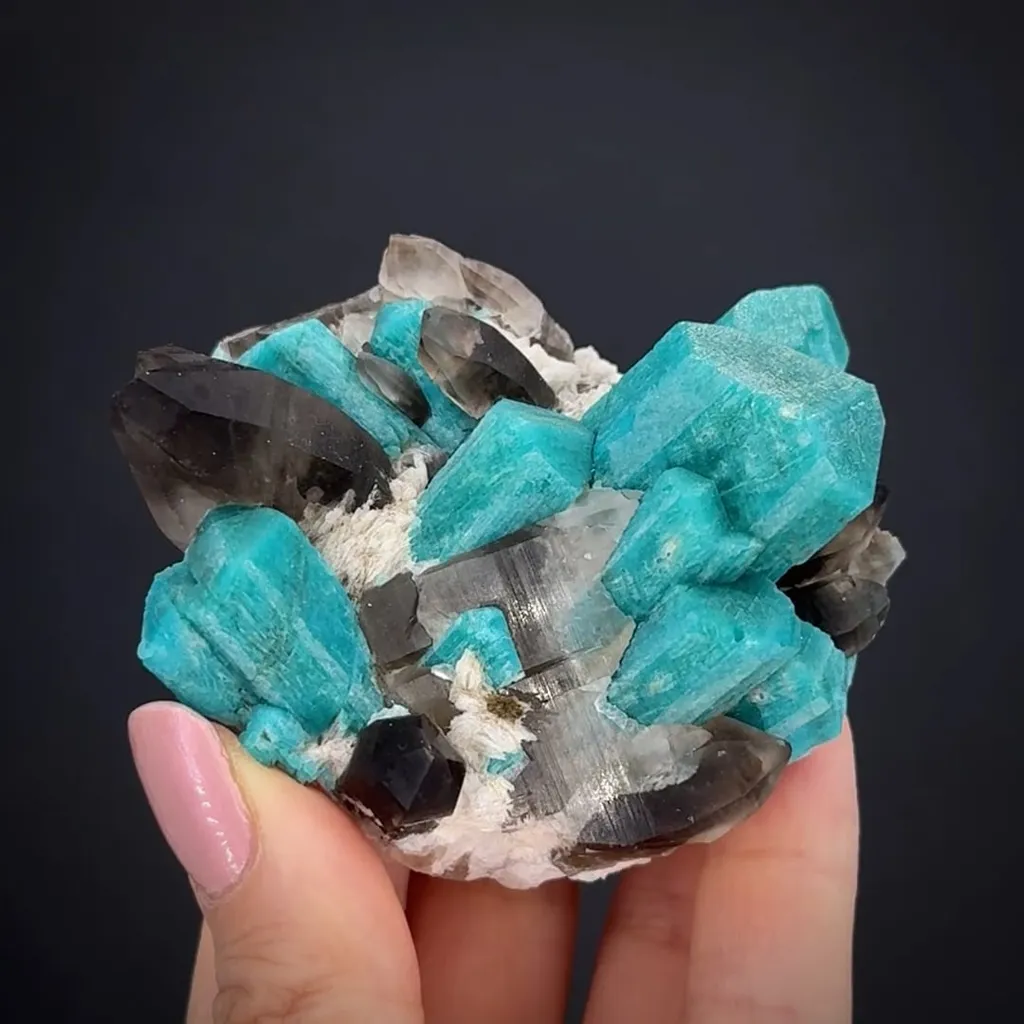 Microcline var. Amazonite with Smoky Quartz, Albite image