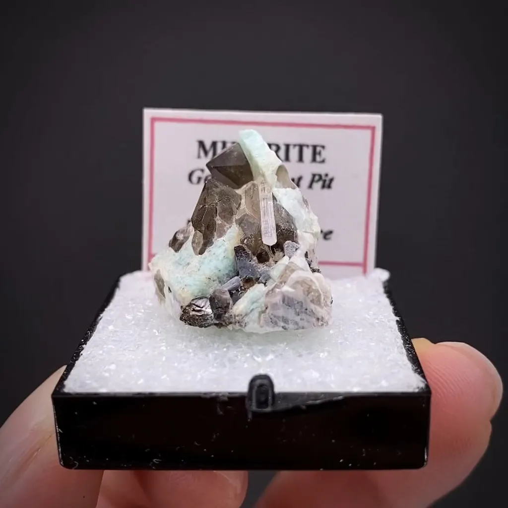 Milarite on Smoky Quartz and Amazonite image