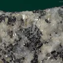 Molybdophyllite with Hausmannite on Calcite - image 4