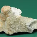 Monteregianite-(Y) (type locality) with Pectolite on Albite - image 1