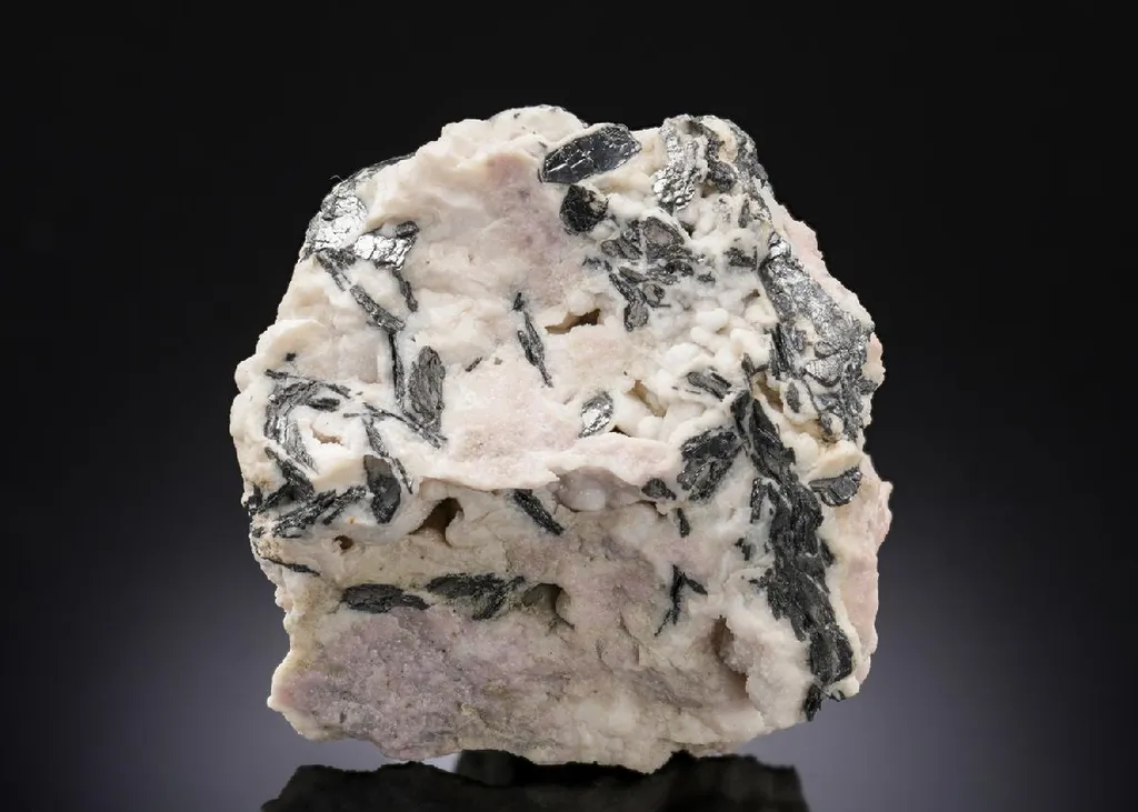 NAGYÁGITE in Rhodochrosite image