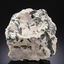 NAGYÁGITE in Rhodochrosite - image 1