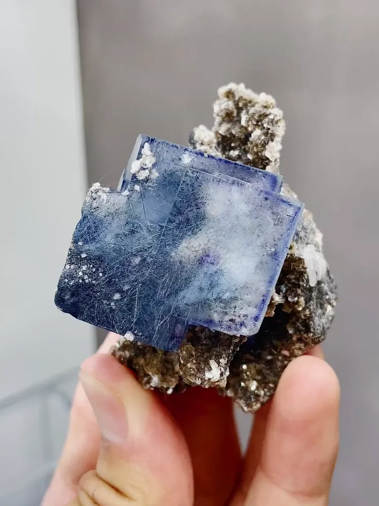 Natural Blue Cubic Fluorite coexists with Jamstenite and Mica comes from Yaogangxian,Hunan 50*60*40MM image