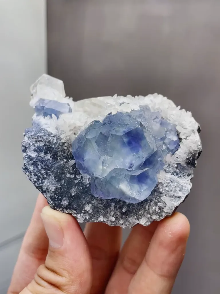 Natural Phantom Fluorite coexists with Mercedes-Benz Calcite and Quartz comes from Fujian,China 65*40*55MM image