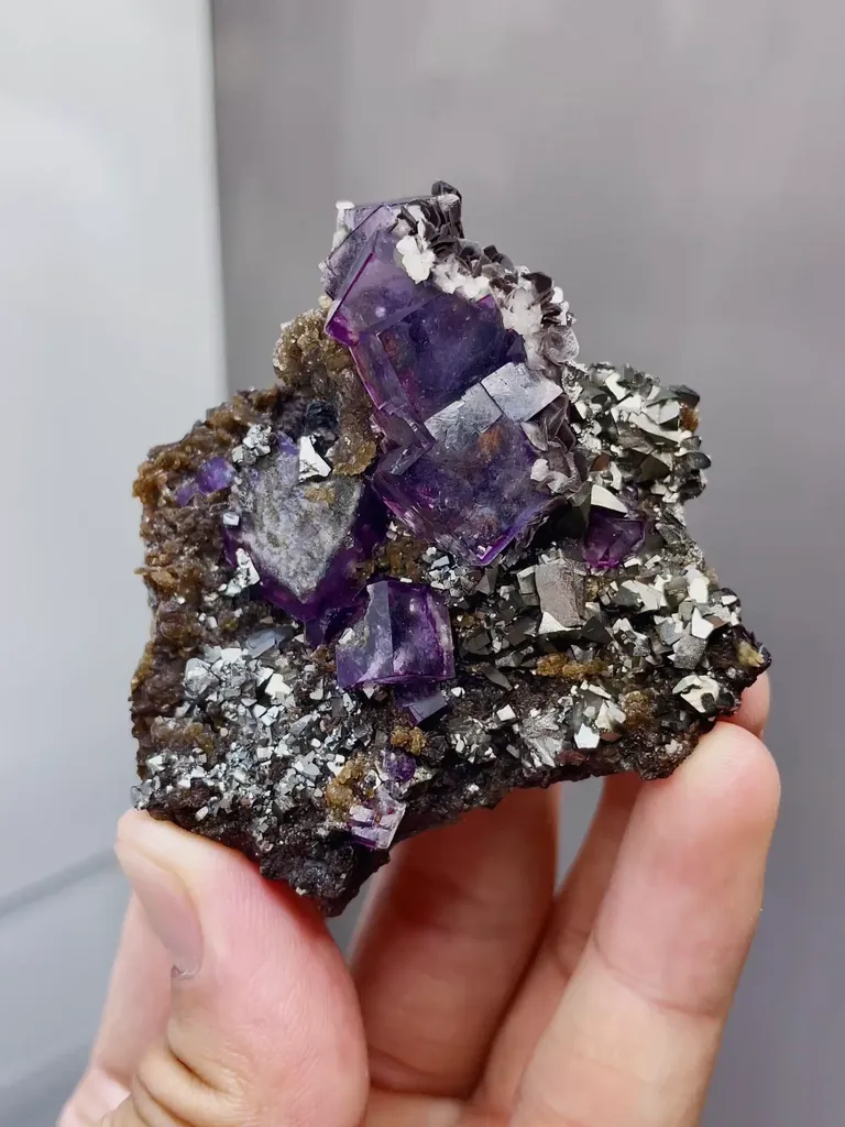 Natural Purple Cubic Fluorite coexists with Toxic Sand comes from Yaogangxian,Hunan 50*25*55MM image