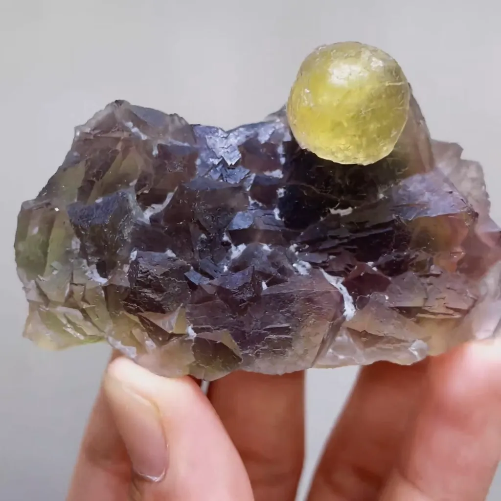 Natural Spherical Yellow Fluorite and Purple Fluorite Symbiosis comes from Zhejiang,China 70*40*30MM image