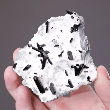 Neptunite and Joaquinite-(CE)