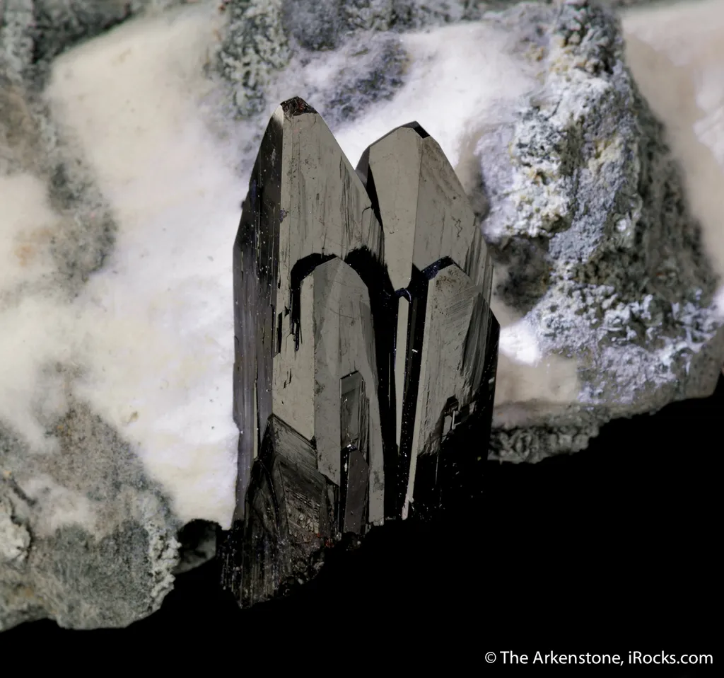 Neptunite on Natrolite image