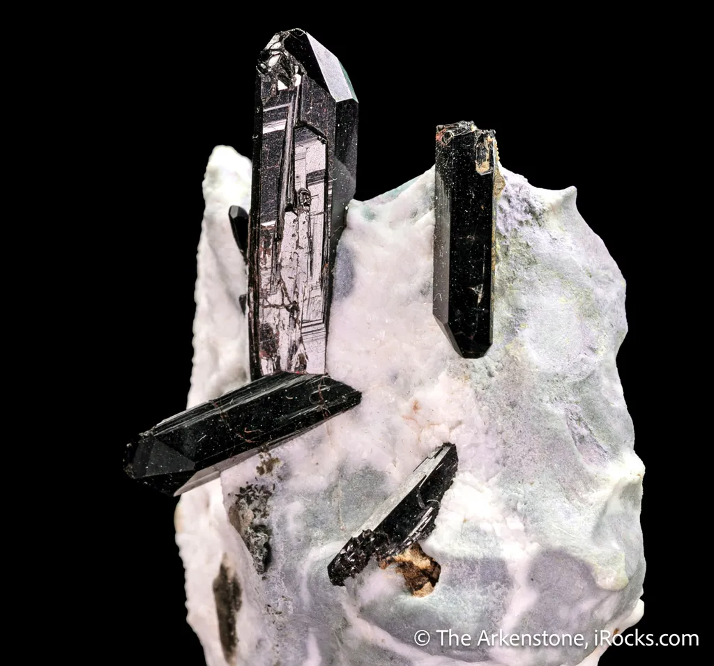 Neptunite on Natrolite