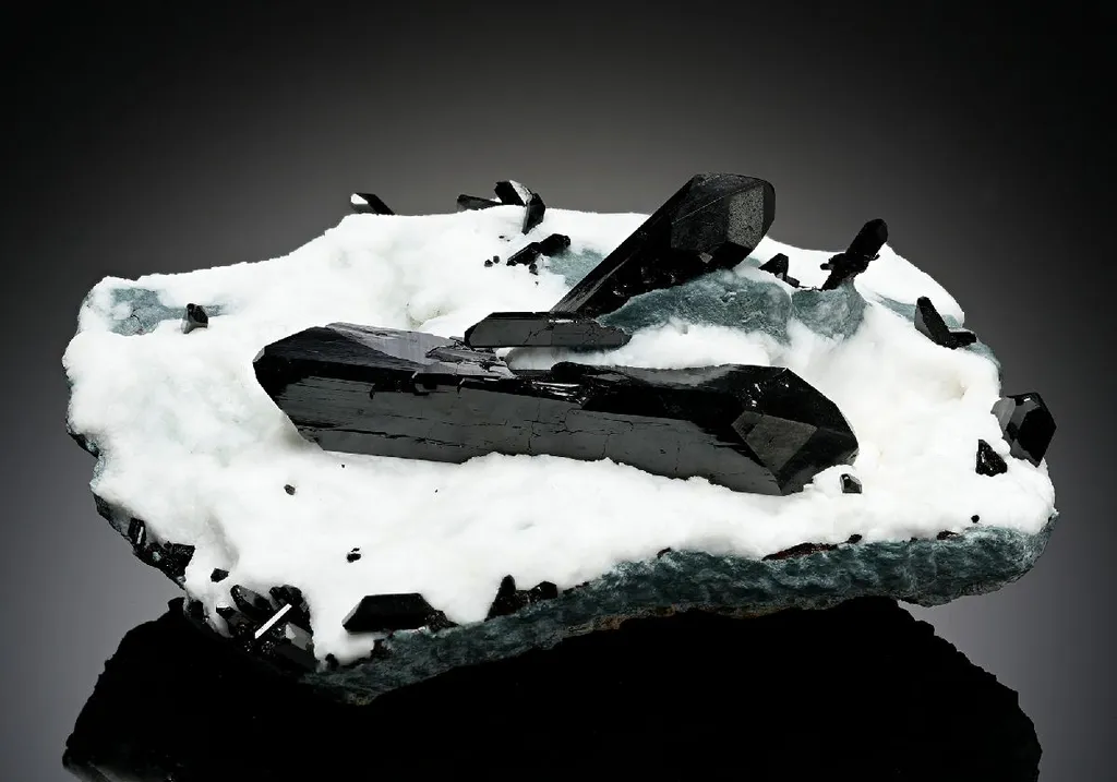 Neptunite with Natrolite image