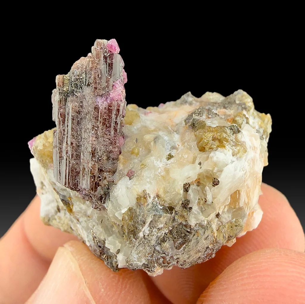 Painite with Corundum image
