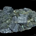 Perovskite (Type Locality) on Clinochlore - image 1