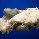 Phenakite on Quartz var. Smoky and Calcite - image 4