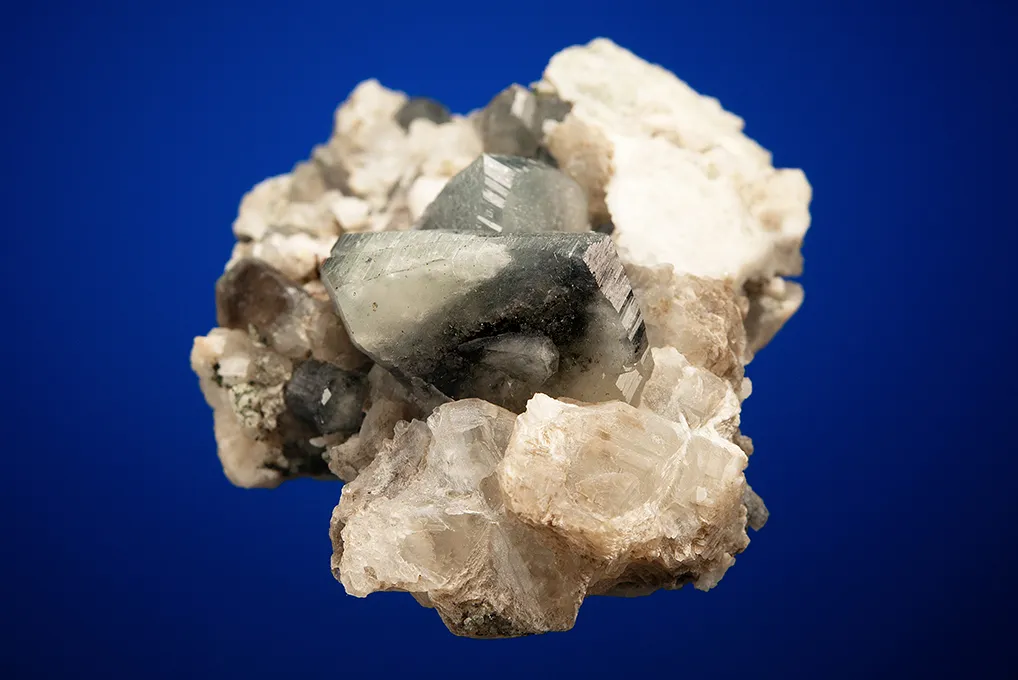 Phenakite on Quartz var. Smoky and Calcite - image 5