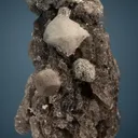 Phenakite with Hematite on Quartz - image 1