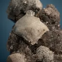 Phenakite with Hematite on Quartz - image 3