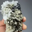 Pyrite after Pyrrhotite with Calcite - image 1