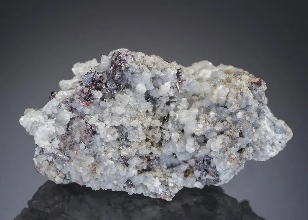 PYROSTILPNITE with Pyrargyrite on Calcite image