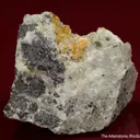 Quintinite-2H with Strontianite, Phlogopite, and Magnetite on carbonatite - image 1