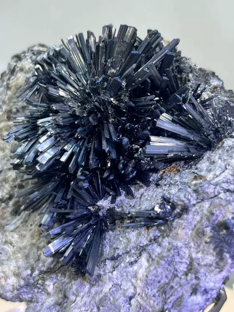 Radiant Spray‑Shaped Stibnite Cluster on Purple Fluorite Matrix, Xikuangshan Mine, Hunan, China - image 3