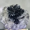 Radiant Spray‑Shaped Stibnite Cluster on Purple Fluorite Matrix, Xikuangshan Mine, Hunan, China - image 1