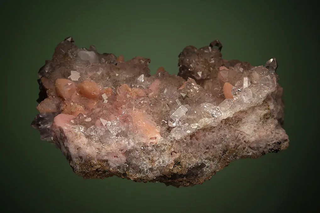 Rhodochrosite after Calcite on Quartz var. Amethyst - image 5