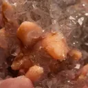 Rhodochrosite after Calcite on Quartz var. Amethyst - image 2