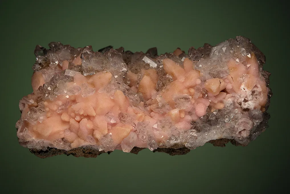 Rhodochrosite after Calcite on Quartz var. Amethyst - image 4