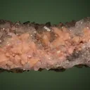 Rhodochrosite after Calcite on Quartz var. Amethyst - image 4