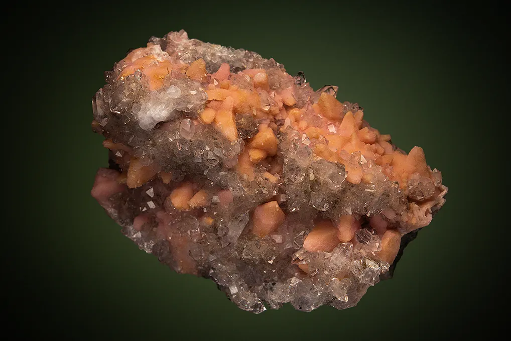 Rhodochrosite after Calcite on Quartz var. Amethyst image