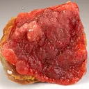 Rhodochrosite, thick boytryoidal layer, approximately 0.5 cm thick on host rock - image 2