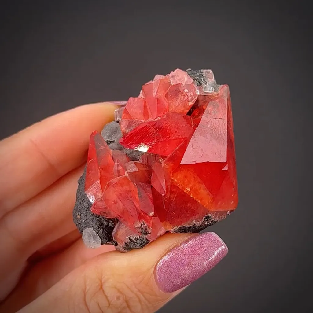 Rhodochrosite with Fluorite on Goethite image