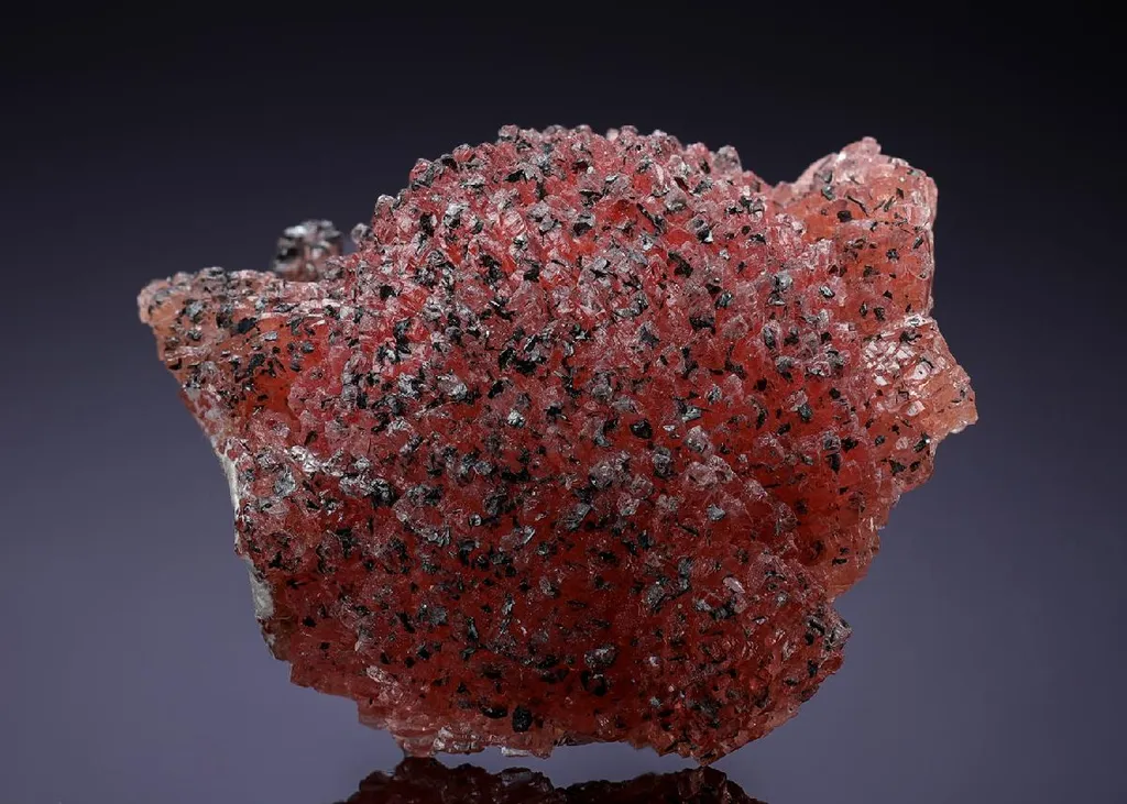 Rhodochrosite with Manganite on Kutnohorite image