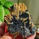 Rutile on Hematite from Novo Horizonte, Bahia, Brasil. Golden Rutile needles on metallic Hematite. Reflective and shiny - image 6