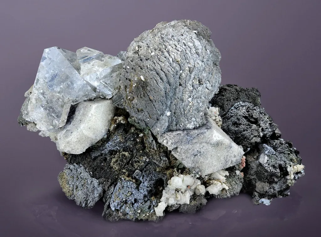 Scheelite, Molybdenite, Fluorite, löllingite, Arsenopyrite, Helvite, Magnetite image