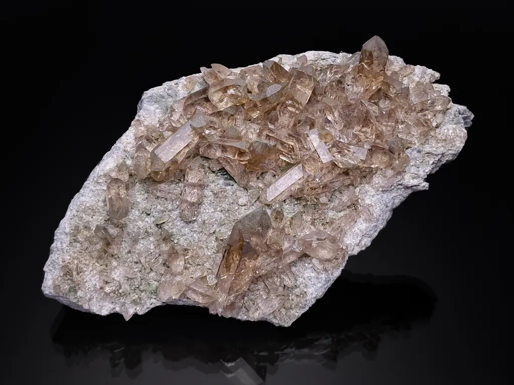 Smoky quartz on matrix with partial chlorite coating on the crystals image