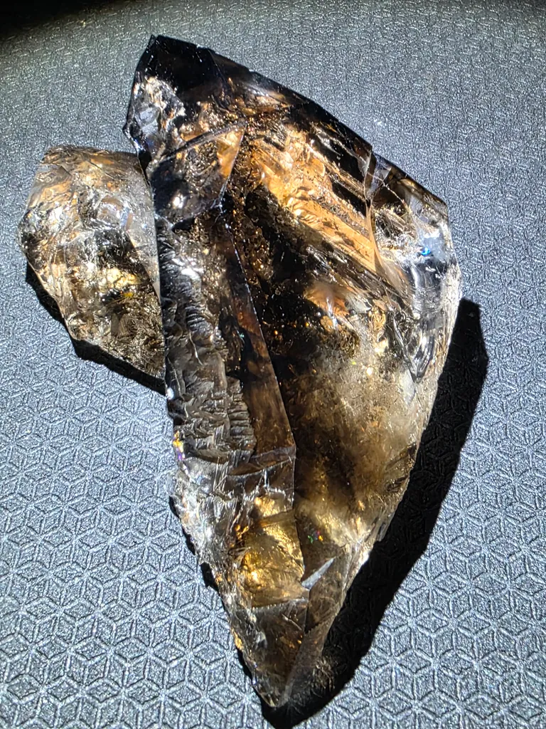 Smoky quartz  with soil inclusions and triangles marks image