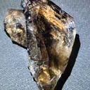 Smoky quartz  with soil inclusions and triangles marks - image 1