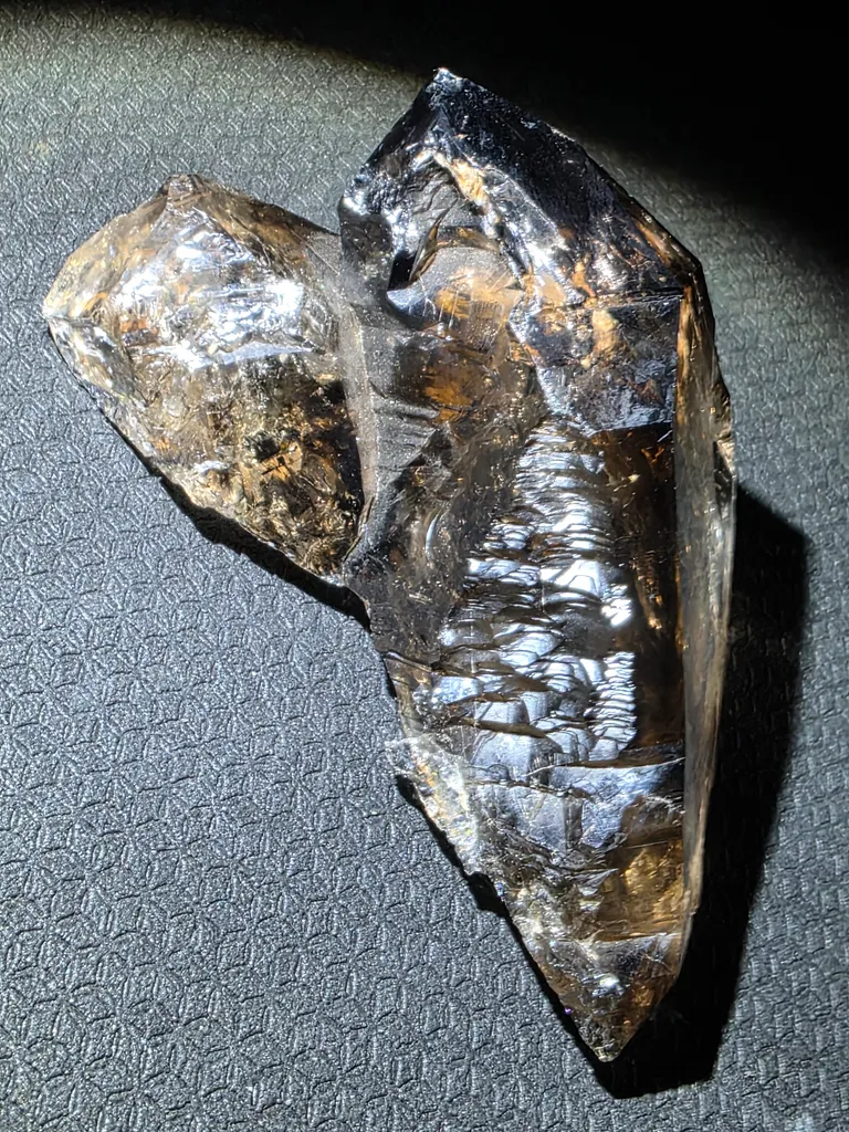 Smoky quartz with soil inclusions and triangles marks - image 2