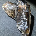 Smoky quartz  with soil inclusions and triangles marks - image 2