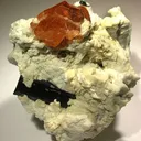 Spessartine Garnet and Schorl in Albite - image 1