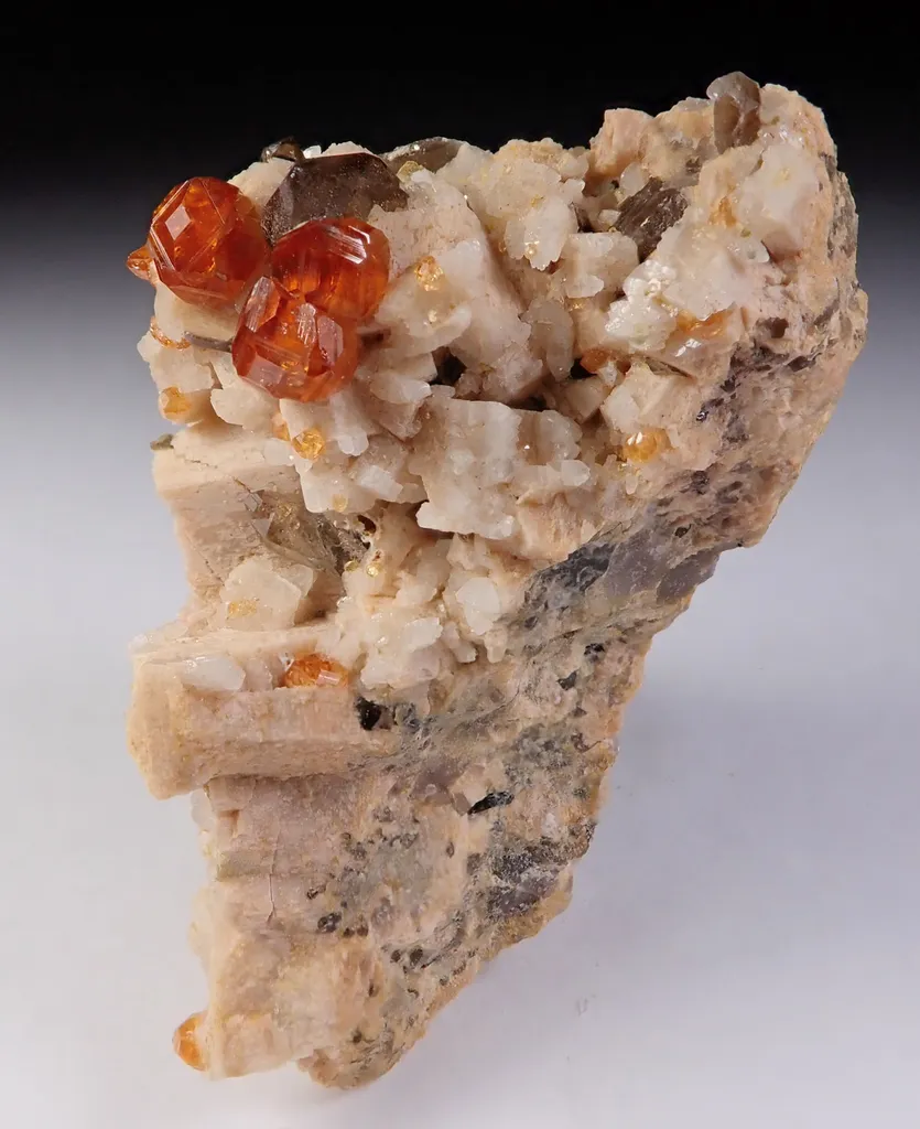 Spessartine Garnet with Quartz and Feldspar image