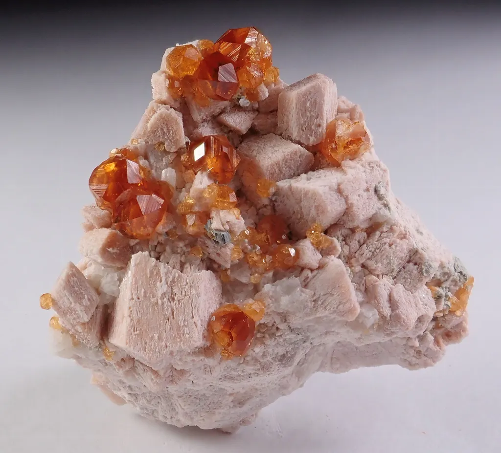 Spessartine Garnet with Quartz and Feldspar image