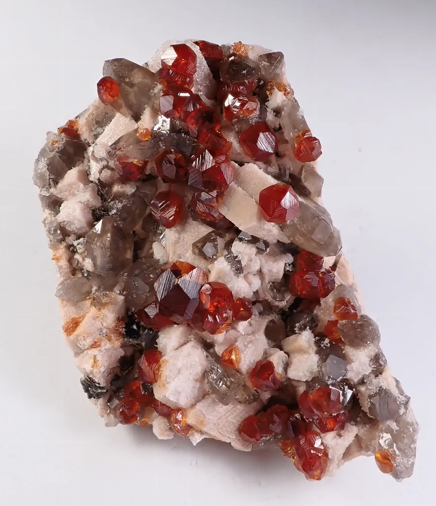 Spessartine Garnet with Quartz and Feldspar image