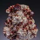 Spessartine on Feldspar with Quartz - image 1