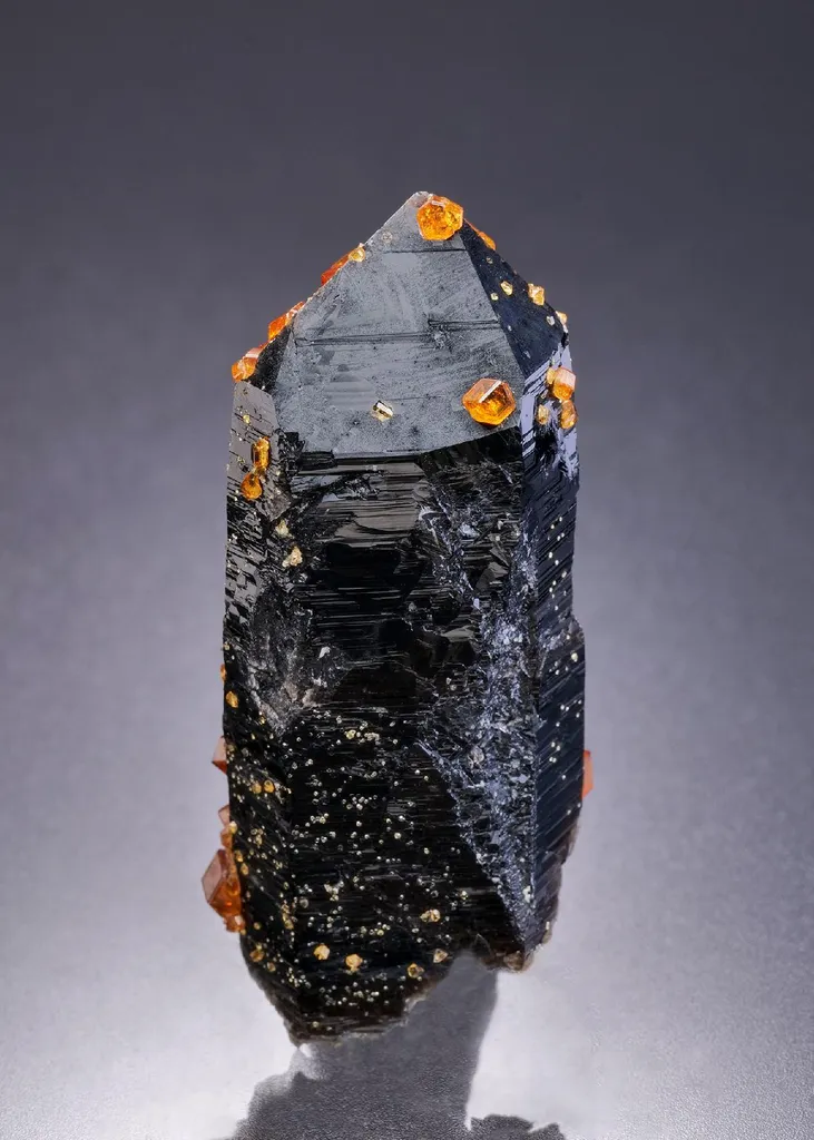 Spessartine on Smoky Quartz image