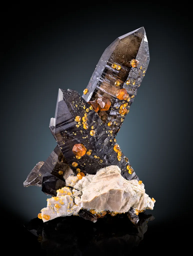 Spessartine on smoky quartz image
