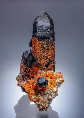 Spessartine on Smoky Quartz on Feldspar